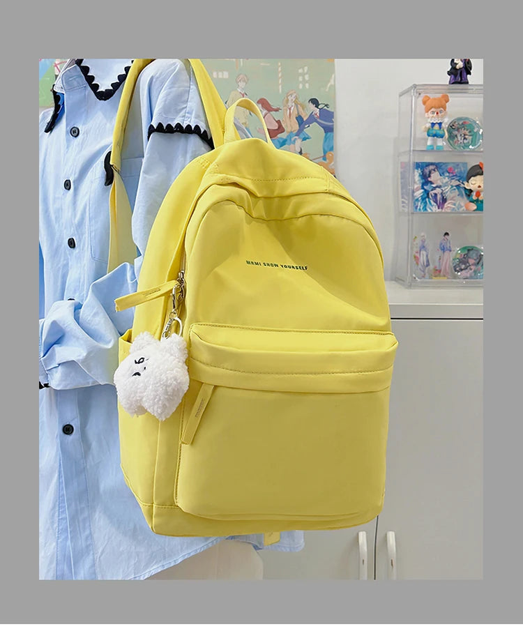 Schoolbags for junior high school girls. They are large-capacity, simple, versatile solid-color double-shoulder bags in ins styl