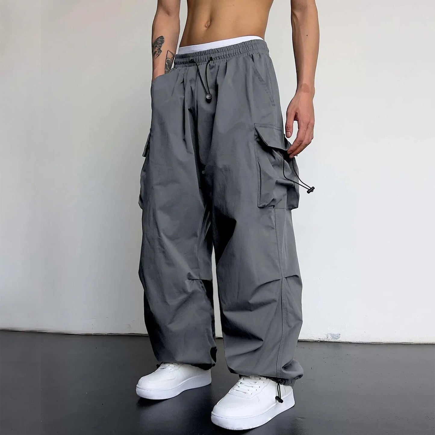 Mens Casual Sports Cargo Pants Woven Pocket Foot Rope Street Tie Solid Pants Mens Multi-Pockets Cargo Pants Pantalones Hombre