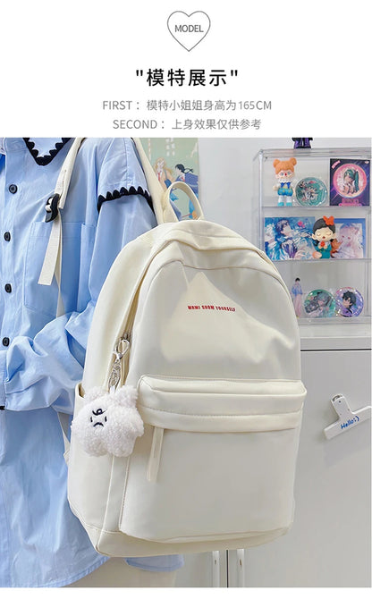 Schoolbags for junior high school girls. They are large-capacity, simple, versatile solid-color double-shoulder bags in ins styl