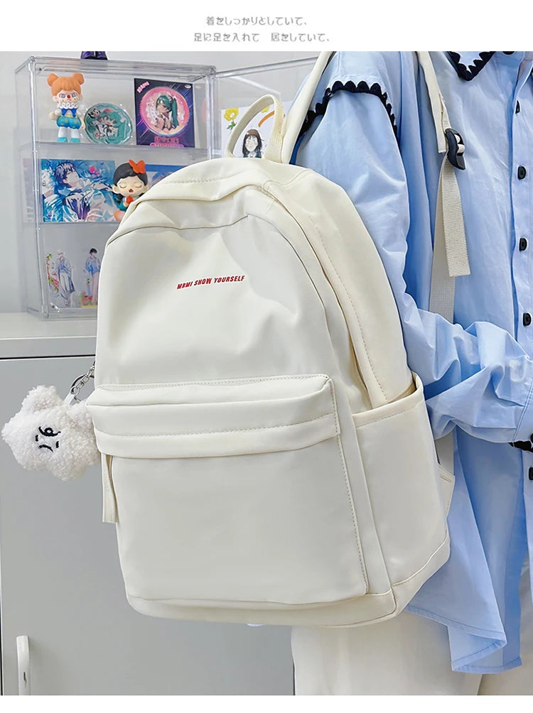 Schoolbags for junior high school girls. They are large-capacity, simple, versatile solid-color double-shoulder bags in ins styl