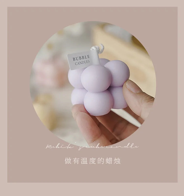 A square ball-shaped scented candle, a colorful birthday gift, a handcrafted candle, and a cute-shaped scented candle