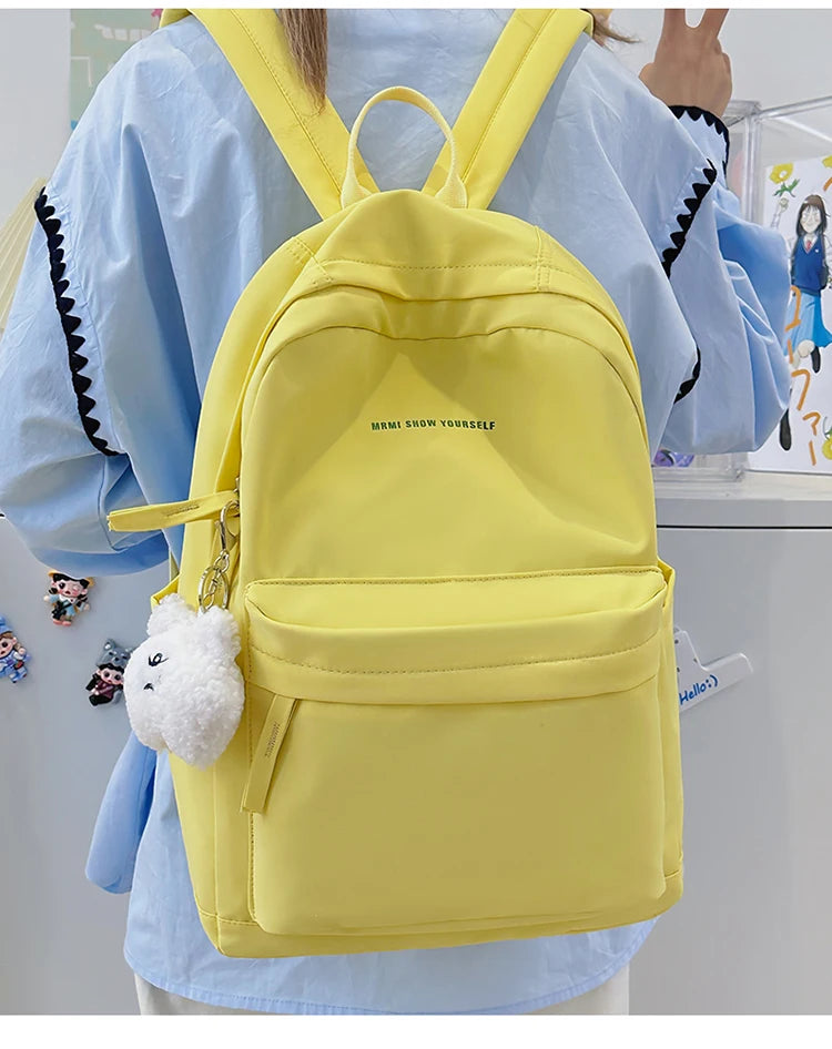 Schoolbags for junior high school girls. They are large-capacity, simple, versatile solid-color double-shoulder bags in ins styl