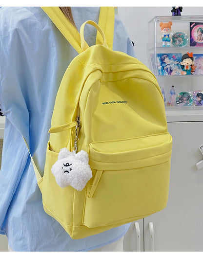 Schoolbags for junior high school girls. They are large-capacity, simple, versatile solid-color double-shoulder bags in ins styl