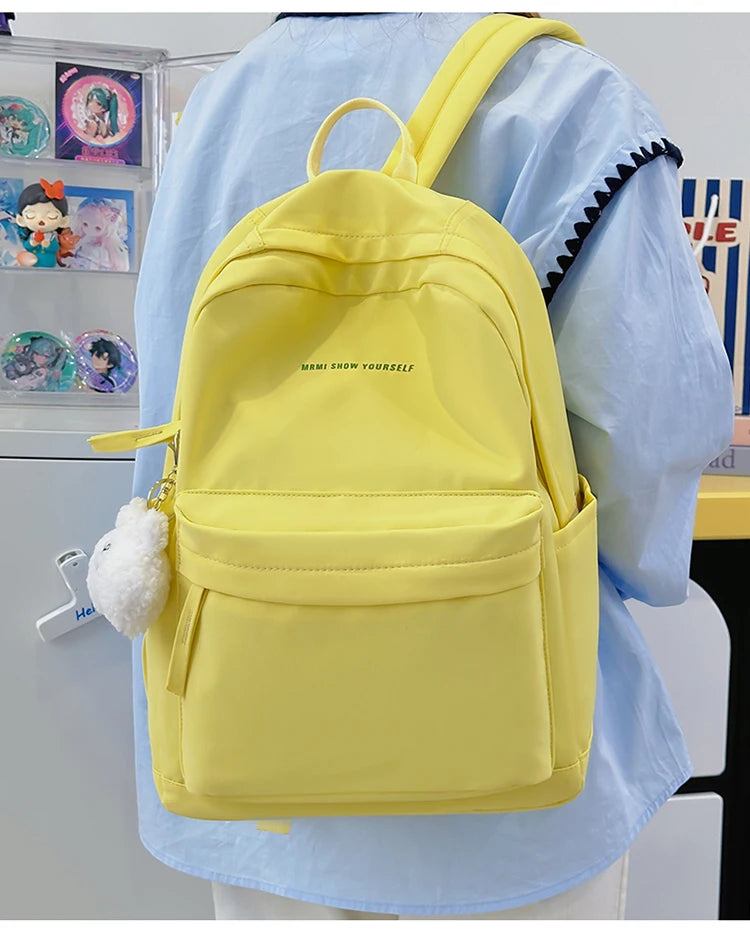 Schoolbags for junior high school girls. They are large-capacity, simple, versatile solid-color double-shoulder bags in ins styl
