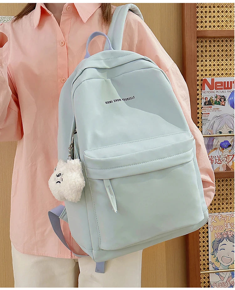 Schoolbags for junior high school girls. They are large-capacity, simple, versatile solid-color double-shoulder bags in ins styl