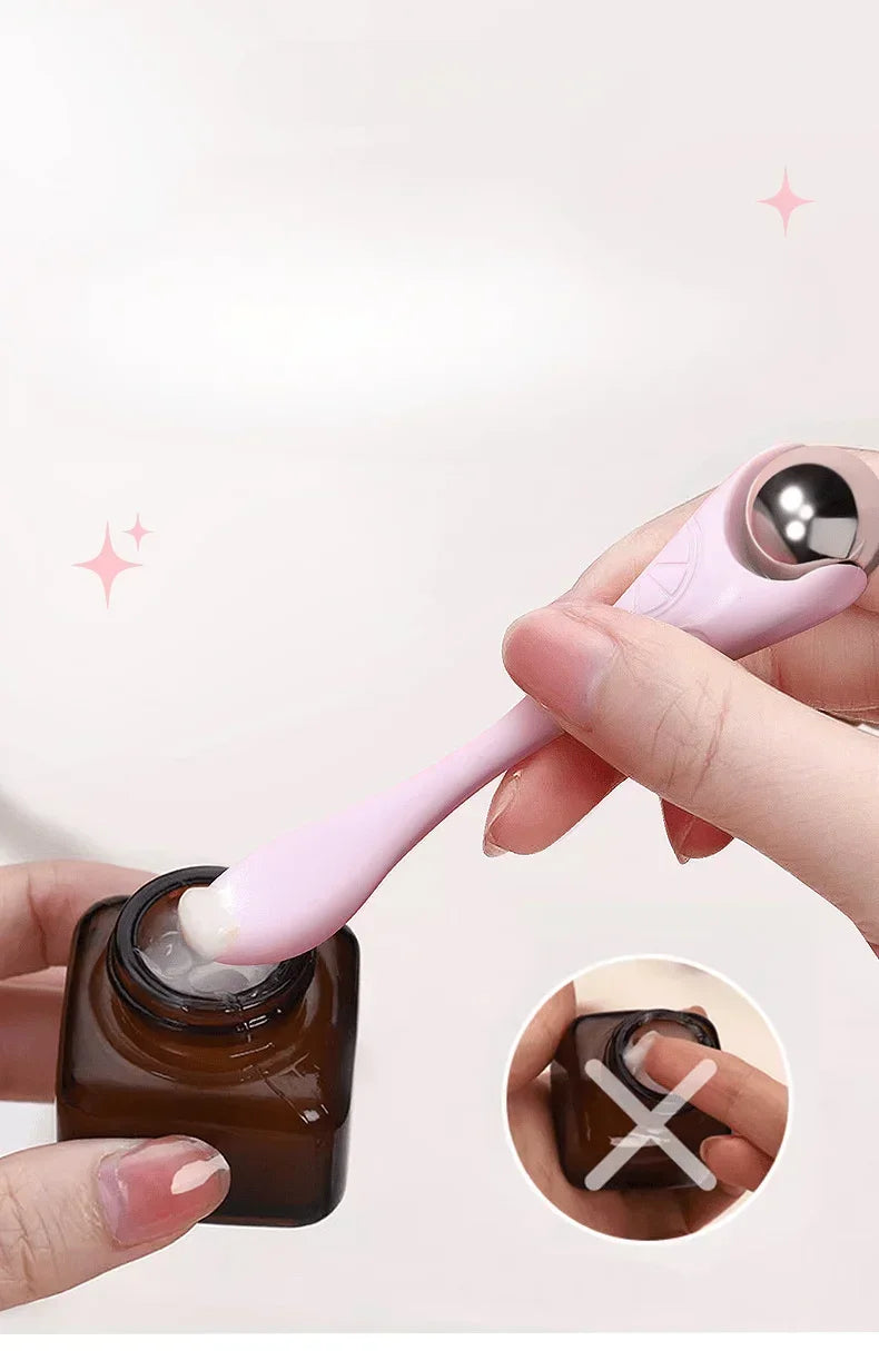 A double-ended manual eye massage roller with a gentle roll-on design for delicate eye treatments