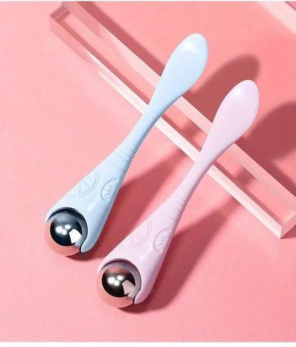 A double-ended manual eye massage roller with a gentle roll-on design for delicate eye treatments