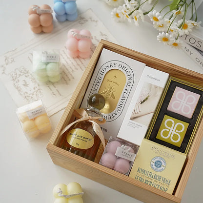 A square ball-shaped scented candle, a colorful birthday gift, a handcrafted candle, and a cute-shaped scented candle