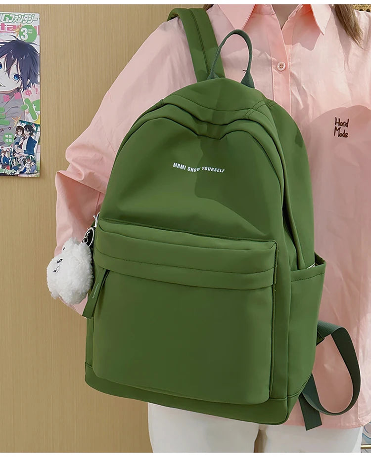 Schoolbags for junior high school girls. They are large-capacity, simple, versatile solid-color double-shoulder bags in ins styl