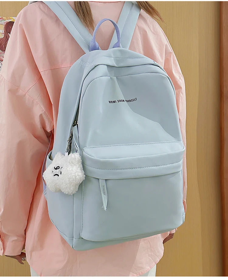 Schoolbags for junior high school girls. They are large-capacity, simple, versatile solid-color double-shoulder bags in ins styl