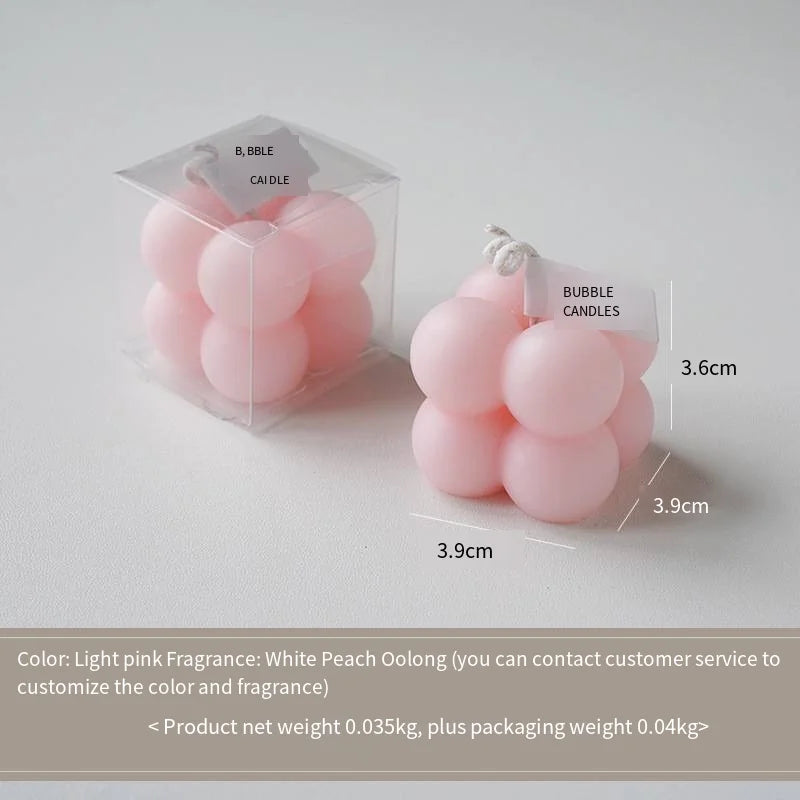 A square ball-shaped scented candle, a colorful birthday gift, a handcrafted candle, and a cute-shaped scented candle