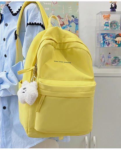Schoolbags for junior high school girls. They are large-capacity, simple, versatile solid-color double-shoulder bags in ins styl