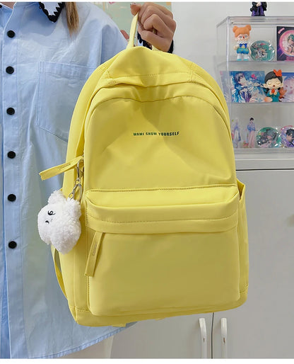 Schoolbags for junior high school girls. They are large-capacity, simple, versatile solid-color double-shoulder bags in ins styl