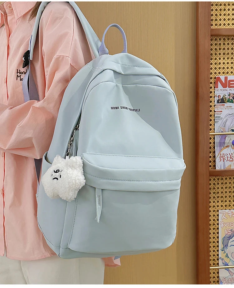 Schoolbags for junior high school girls. They are large-capacity, simple, versatile solid-color double-shoulder bags in ins styl
