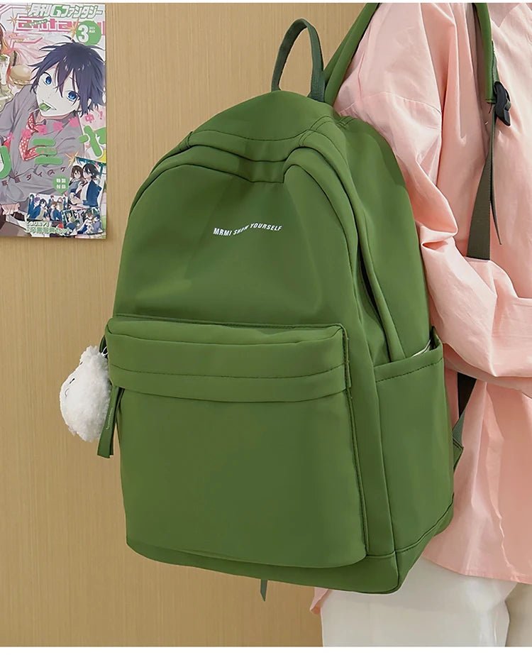 Schoolbags for junior high school girls. They are large-capacity, simple, versatile solid-color double-shoulder bags in ins styl