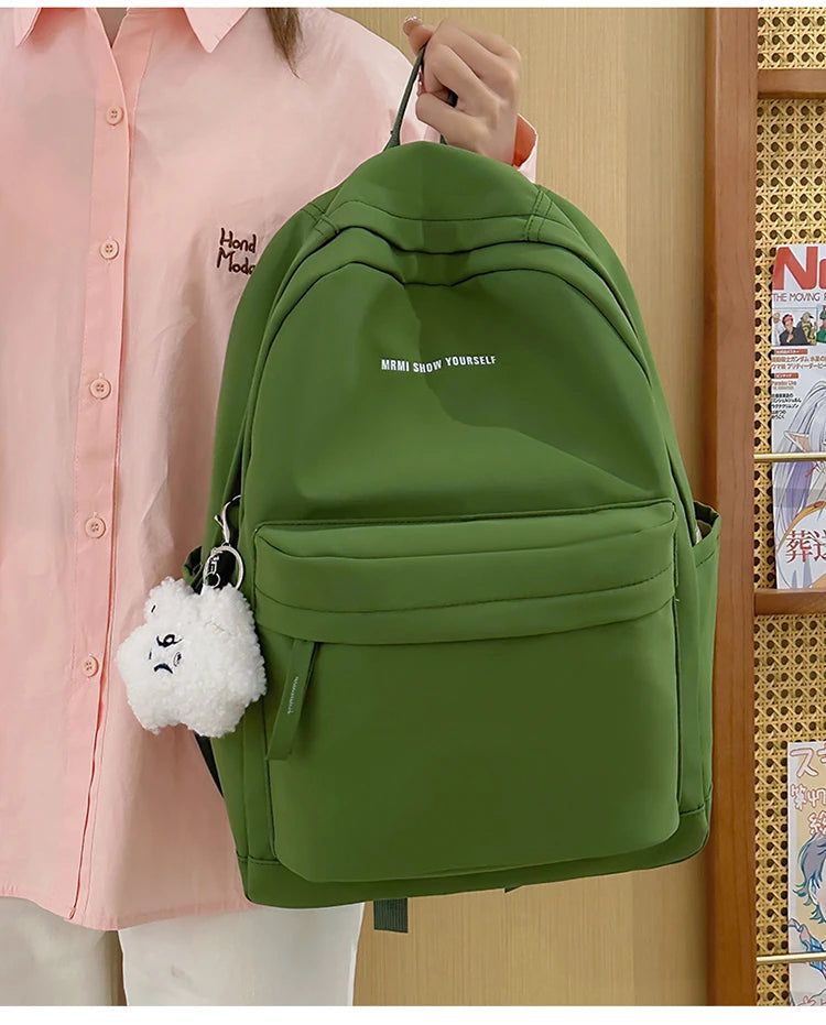 Schoolbags for junior high school girls. They are large-capacity, simple, versatile solid-color double-shoulder bags in ins styl