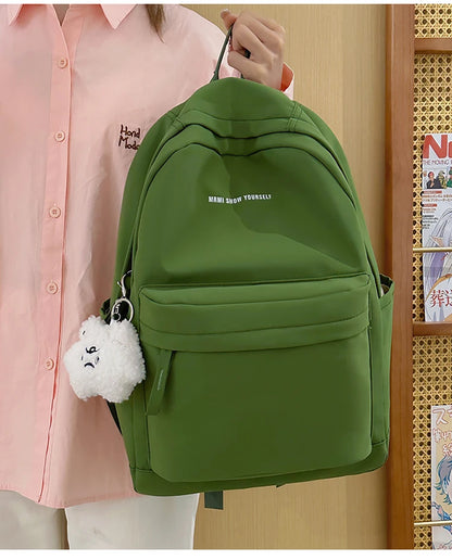 Schoolbags for junior high school girls. They are large-capacity, simple, versatile solid-color double-shoulder bags in ins styl