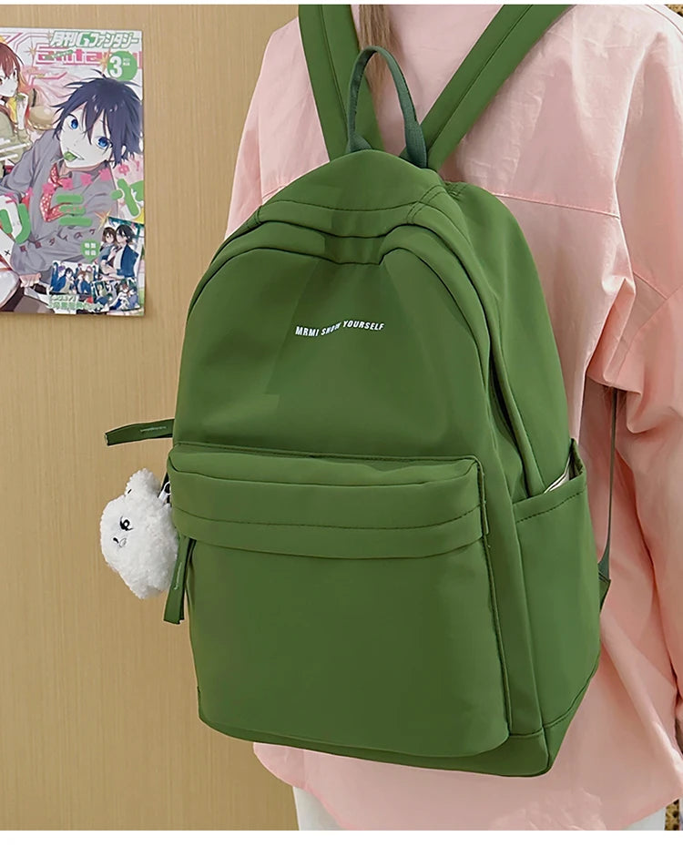 Schoolbags for junior high school girls. They are large-capacity, simple, versatile solid-color double-shoulder bags in ins styl