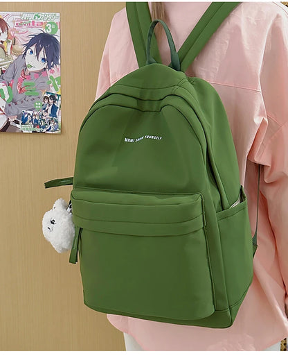 Schoolbags for junior high school girls. They are large-capacity, simple, versatile solid-color double-shoulder bags in ins styl