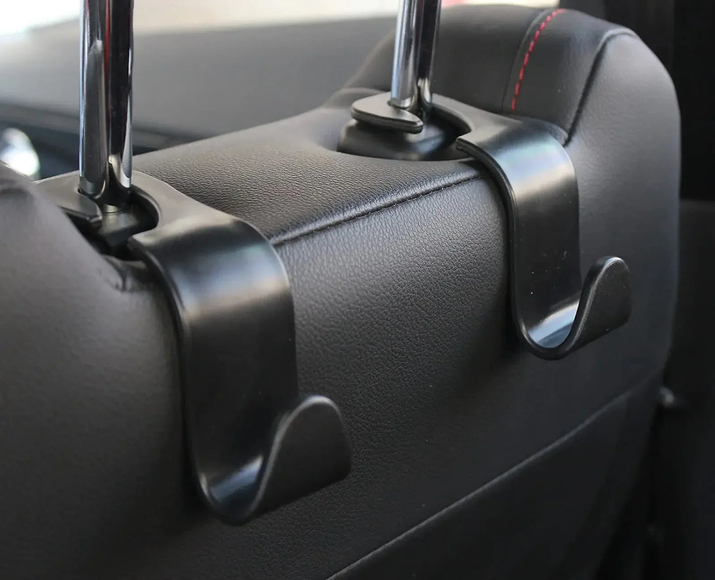 Four headrest hooks for the front seats of a car. Car seat hooks are internal accessories of a car