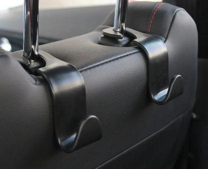 Four headrest hooks for the front seats of a car. Car seat hooks are internal accessories of a car
