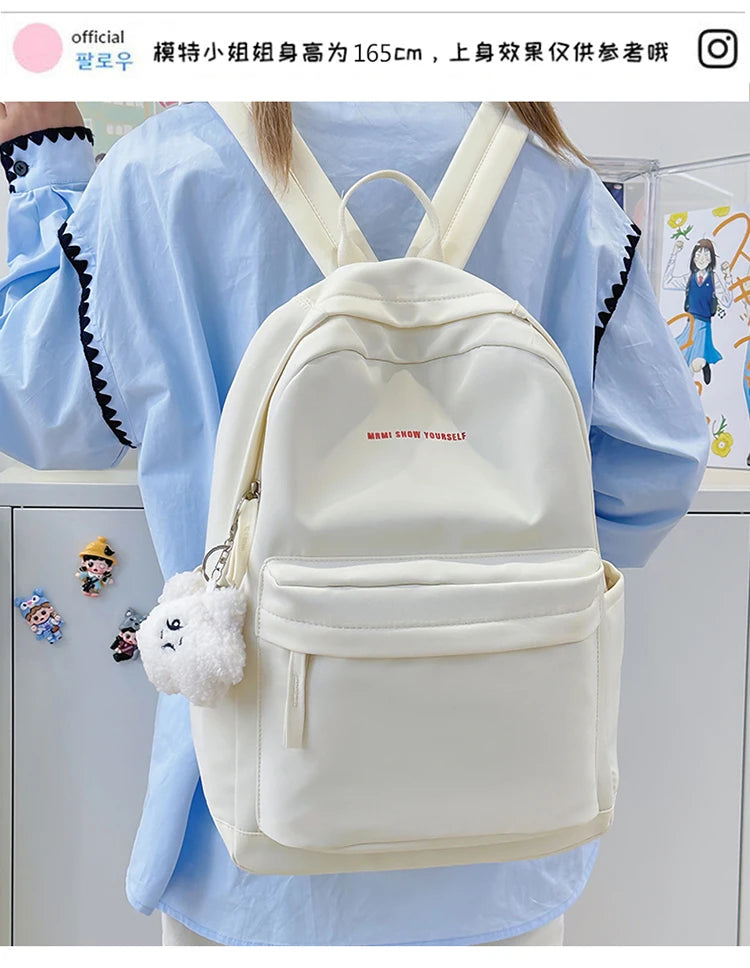 Schoolbags for junior high school girls. They are large-capacity, simple, versatile solid-color double-shoulder bags in ins styl