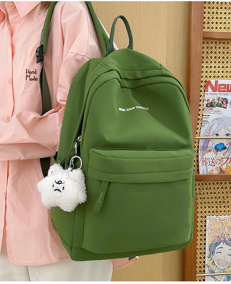 Schoolbags for junior high school girls. They are large-capacity, simple, versatile solid-color double-shoulder bags in ins styl