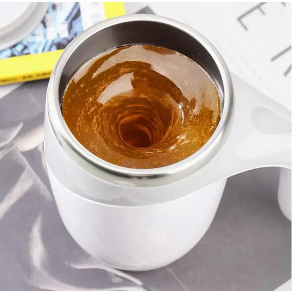Self mixing mug: a self mixing coffee cup, a rotating home office travel mixing cup, used for mixing coffee, chocolate, etc